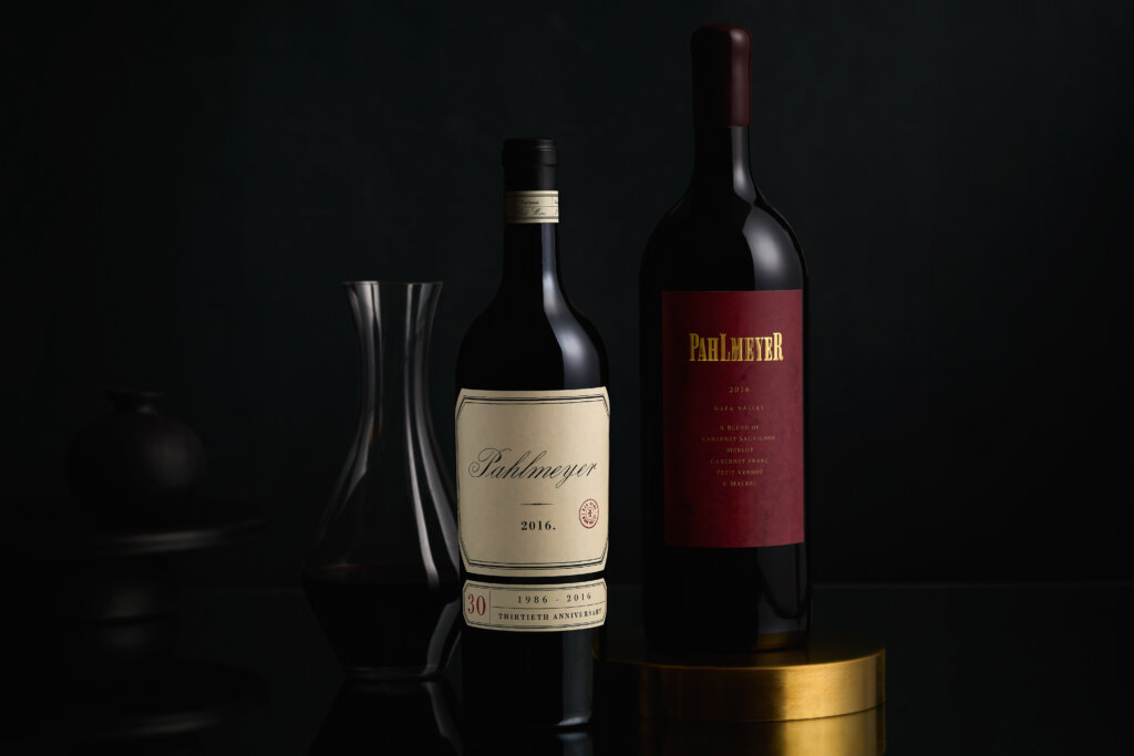 2016 Pahlmeyer Propriteary Red 750mL bottle with a 1500 ml bottle with throwback label and decanter with wine.